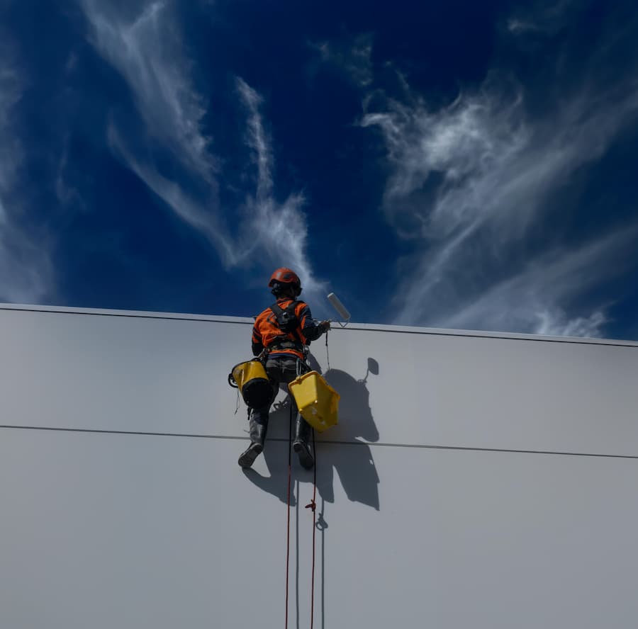 Industrial climber performing a task at height