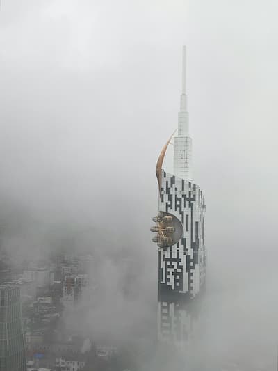 Tall building in foggy conditions, ideal for industrial climbers